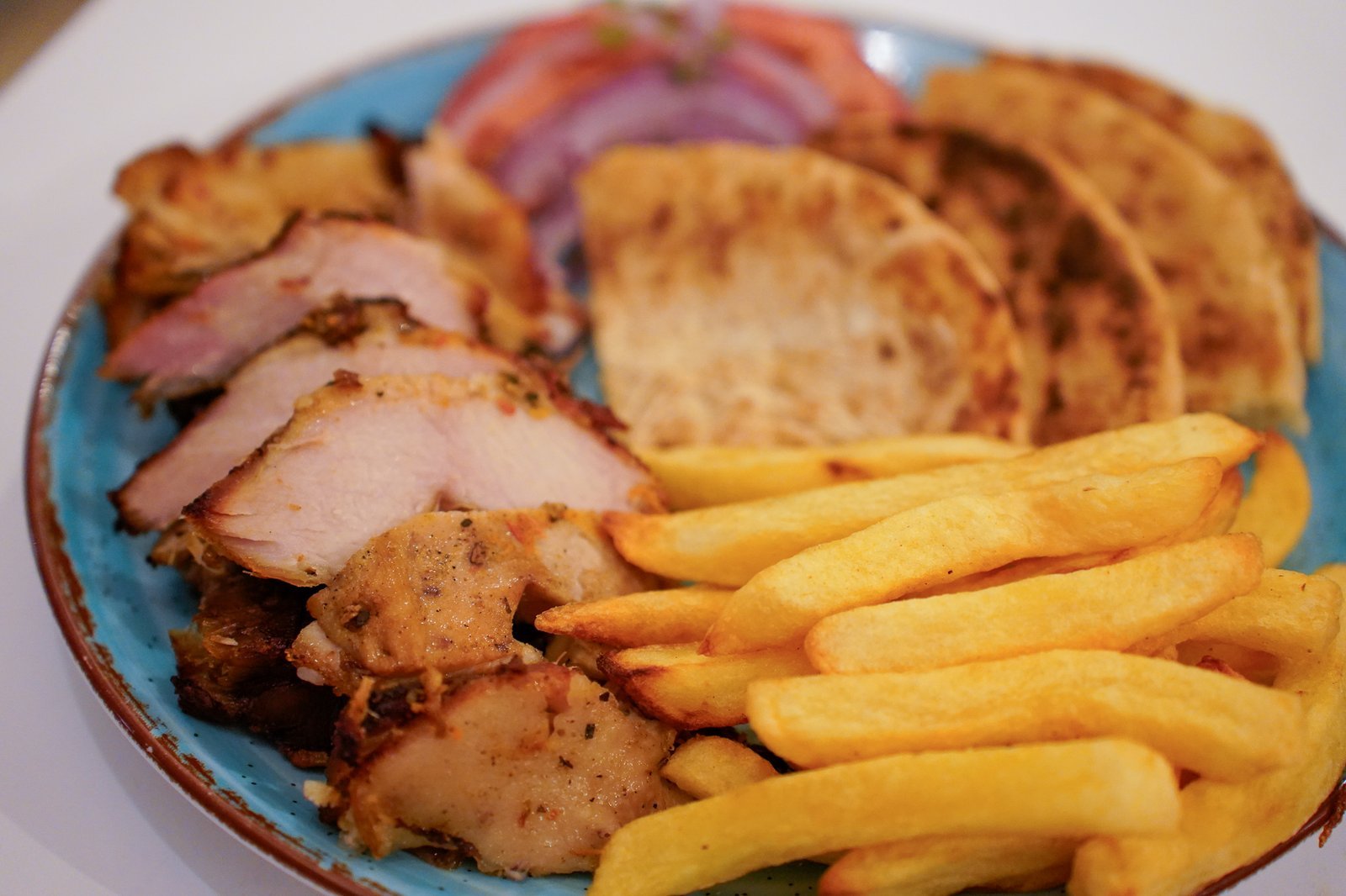 Grilled meat served with sides